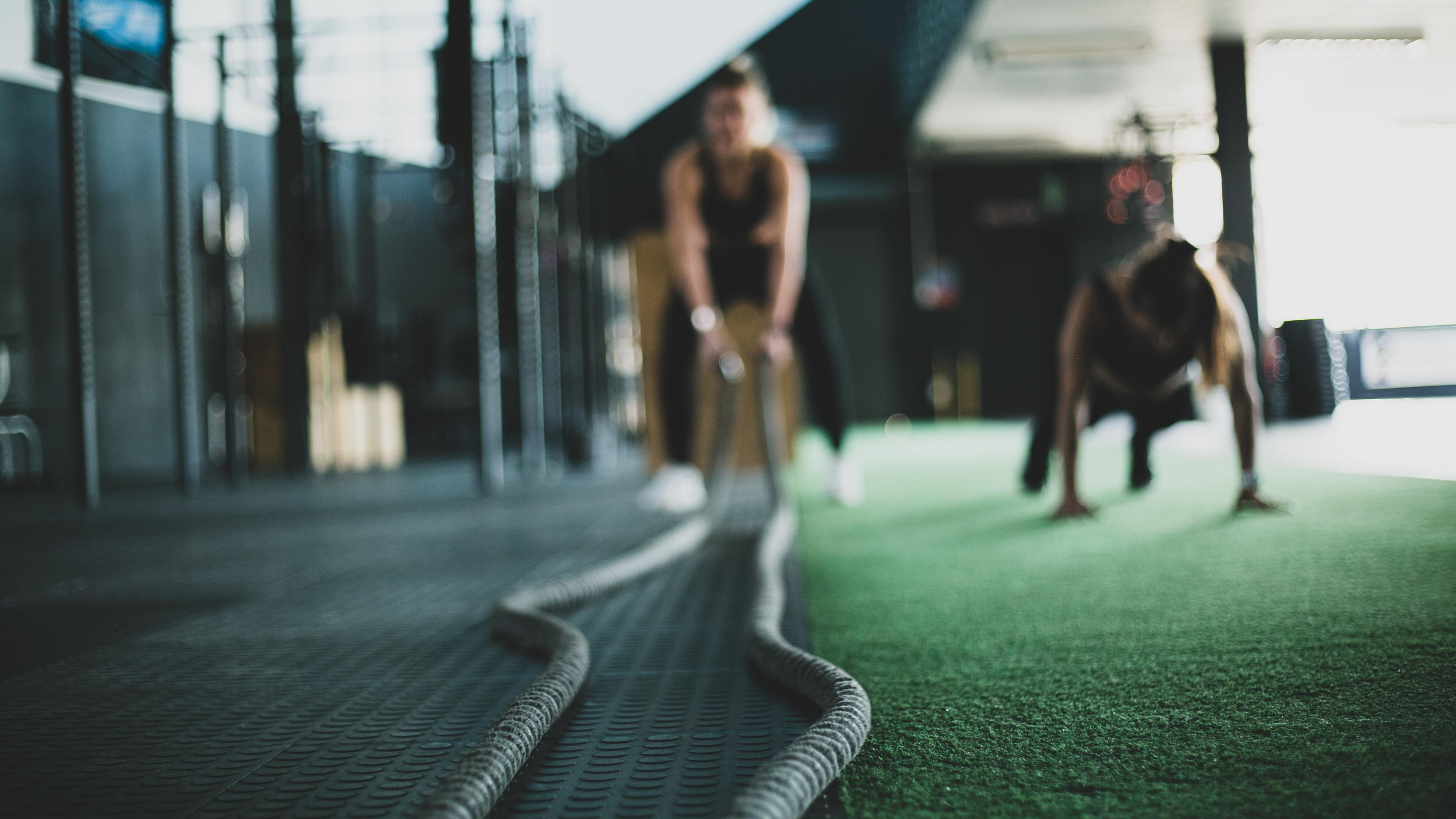 Picture of two people training on a gym